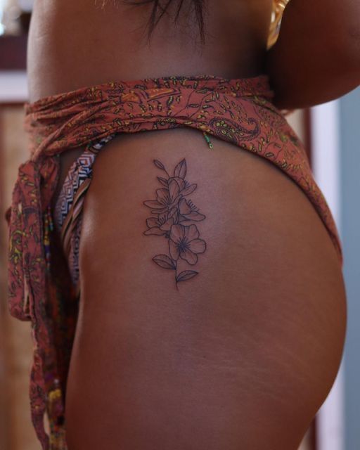 Elegant Minimalist Floral Hip Tattoo