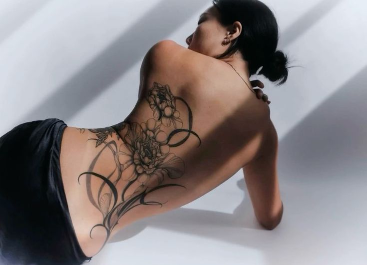 Elegant Minimalist Floral Back Tattoo
