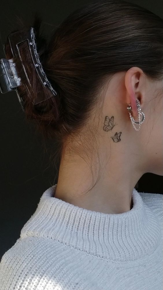 delicate butterfly neck tattoo design