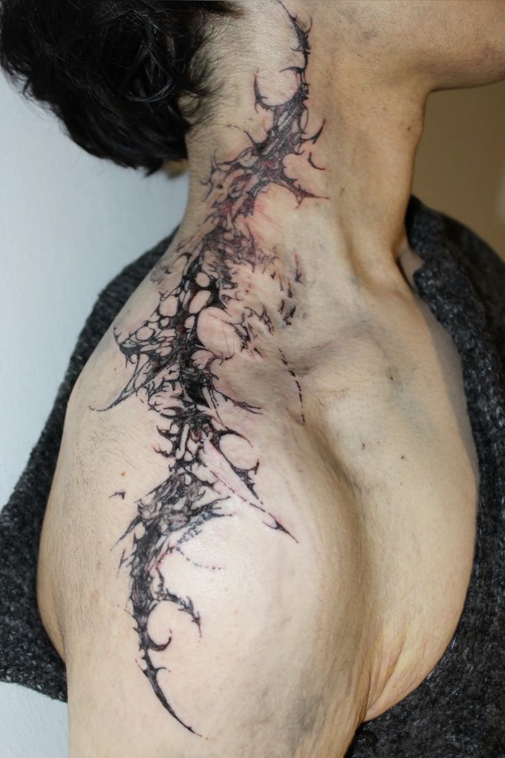 bold abstract neck tattoo design