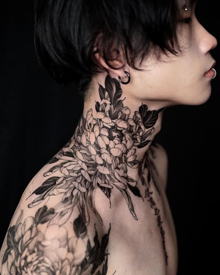 elegant blackwork floral neck tattoo