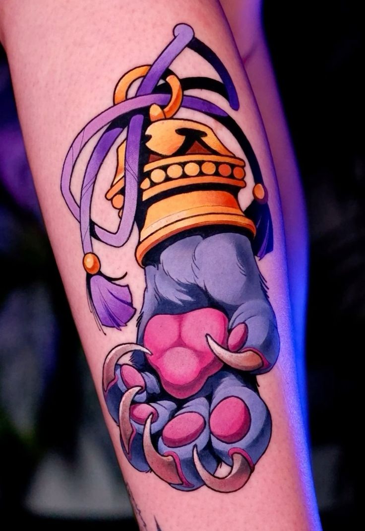 Vibrant Neo-Traditional Animal Paw Tattoo
