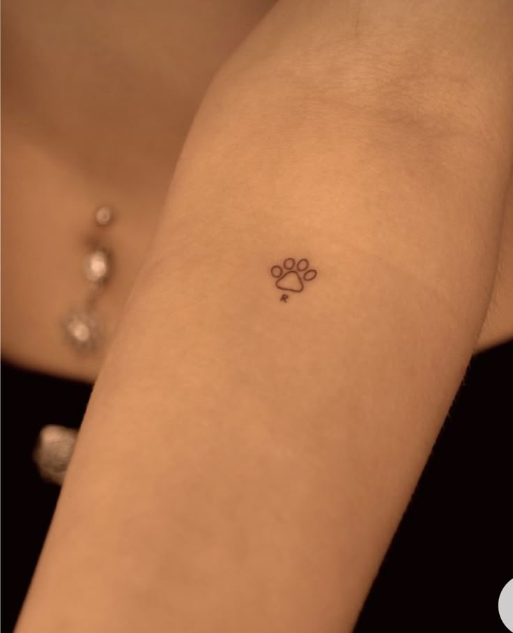Charming Minimalist Paw Print Tattoo