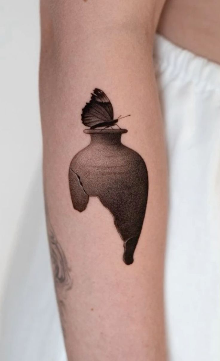 Elegant Butterfly and Vase Tattoo Design