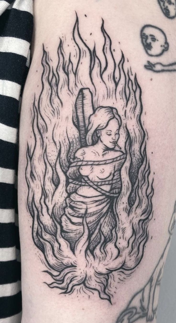 Enigmatic Flame Portrait Tattoo