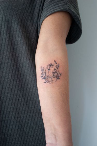 Charming Dog Portrait Tattoo with Floral Accents