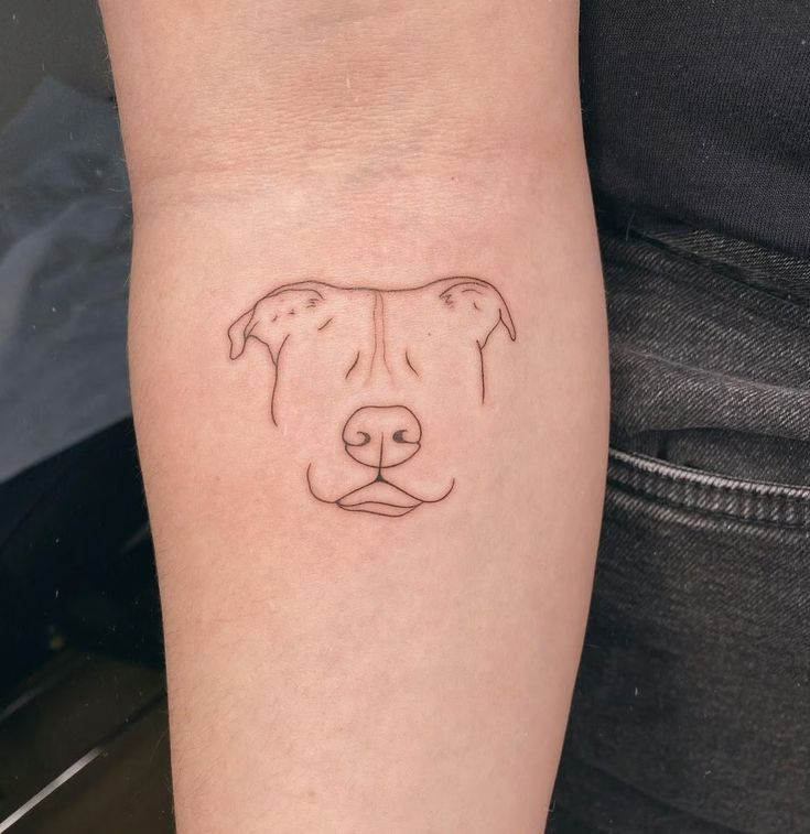 Minimalist Dog Portrait Tattoo: A Subtle Tribute