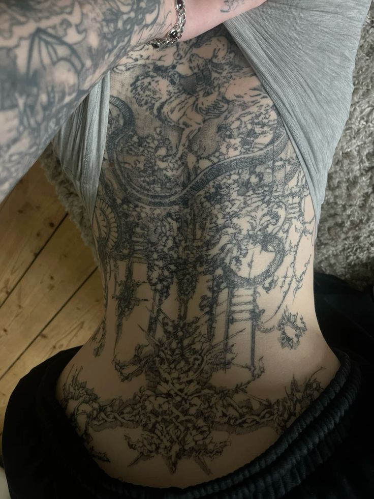 Intricate Blackwork Backpiece Tattoo