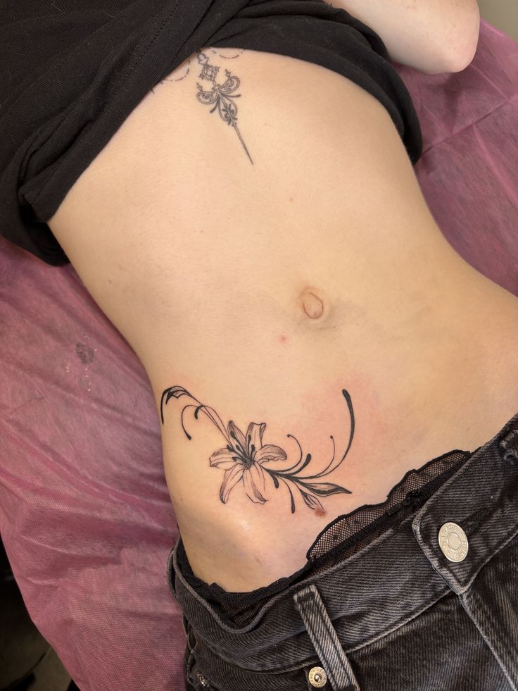 Elegant Floral Rib Tattoo Design