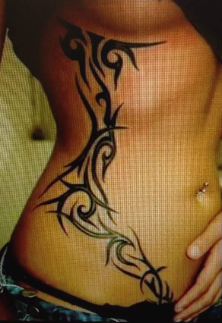 Elegant Tribal Rib Tattoo Design