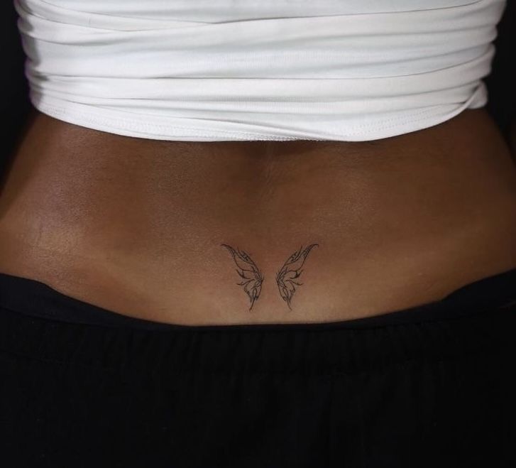 Delicate Butterfly Rib Tattoo