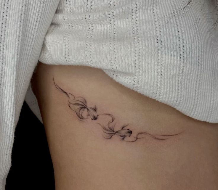 Delicate Minimalist Rib Tattoo Design