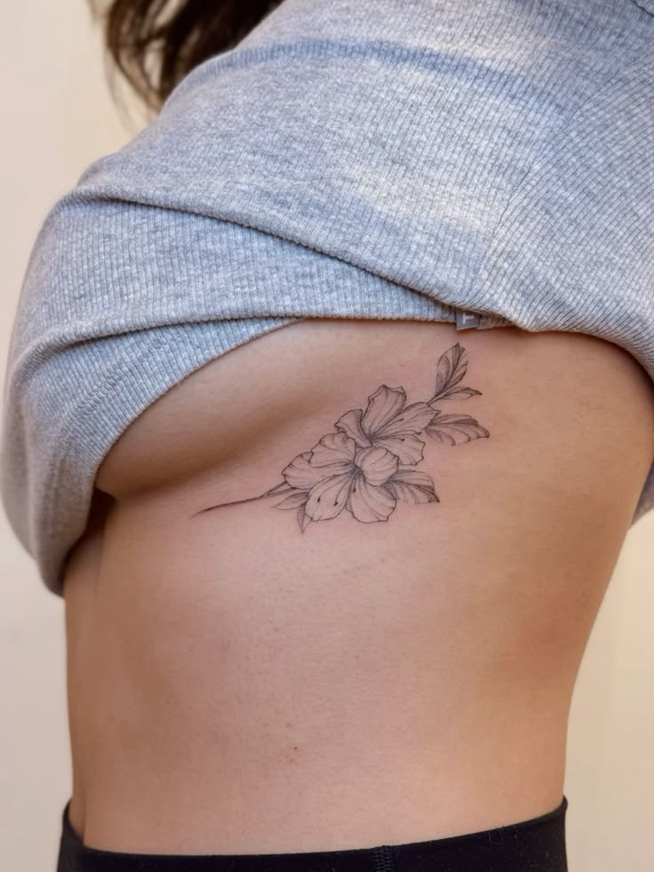 Elegant Floral Rib Tattoo Design