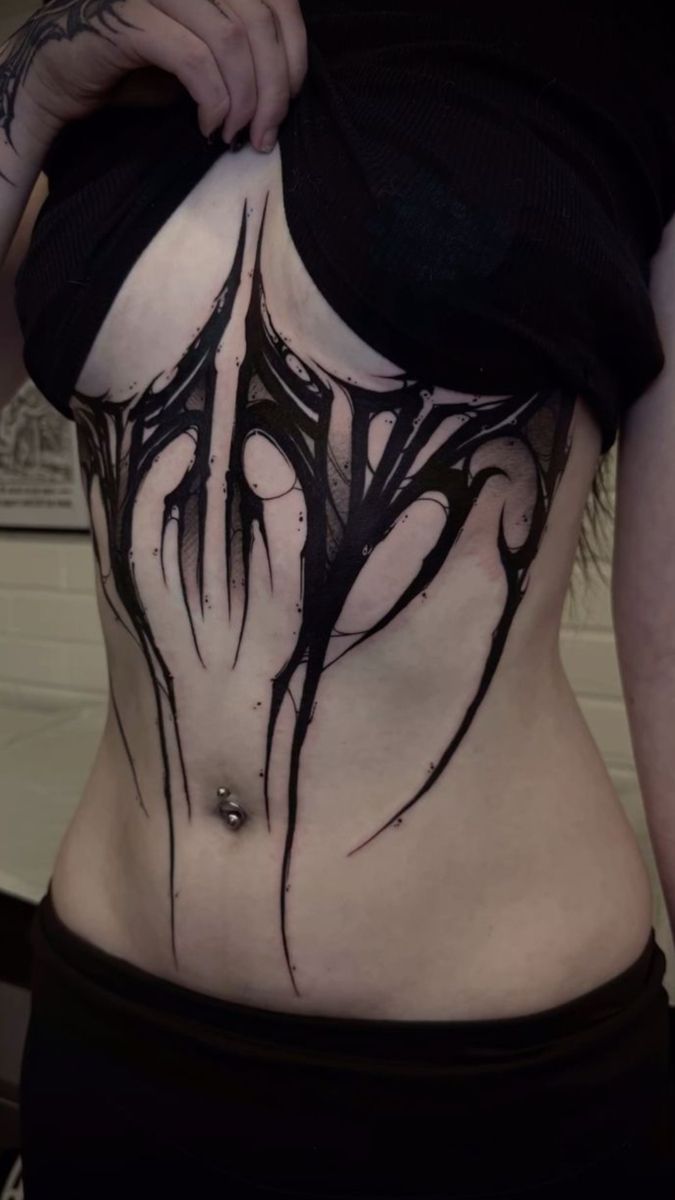 Bold Blackwork Ribcage Tattoo