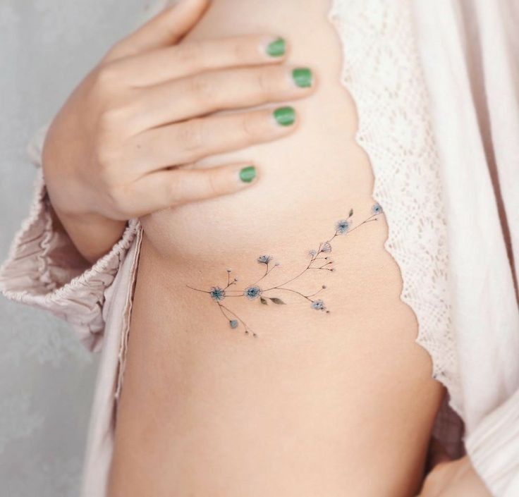Delicate Floral Rib Tattoo Inspiration