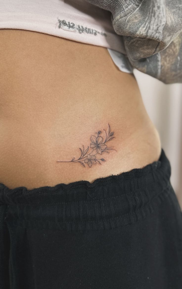 Delicate Floral Rib Tattoo