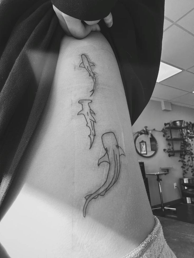 sleek shark rib tattoo
