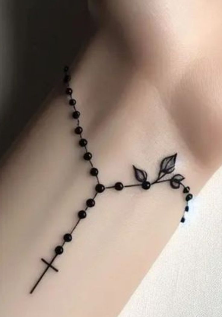 Elegant Blackwork Rosary Tattoo