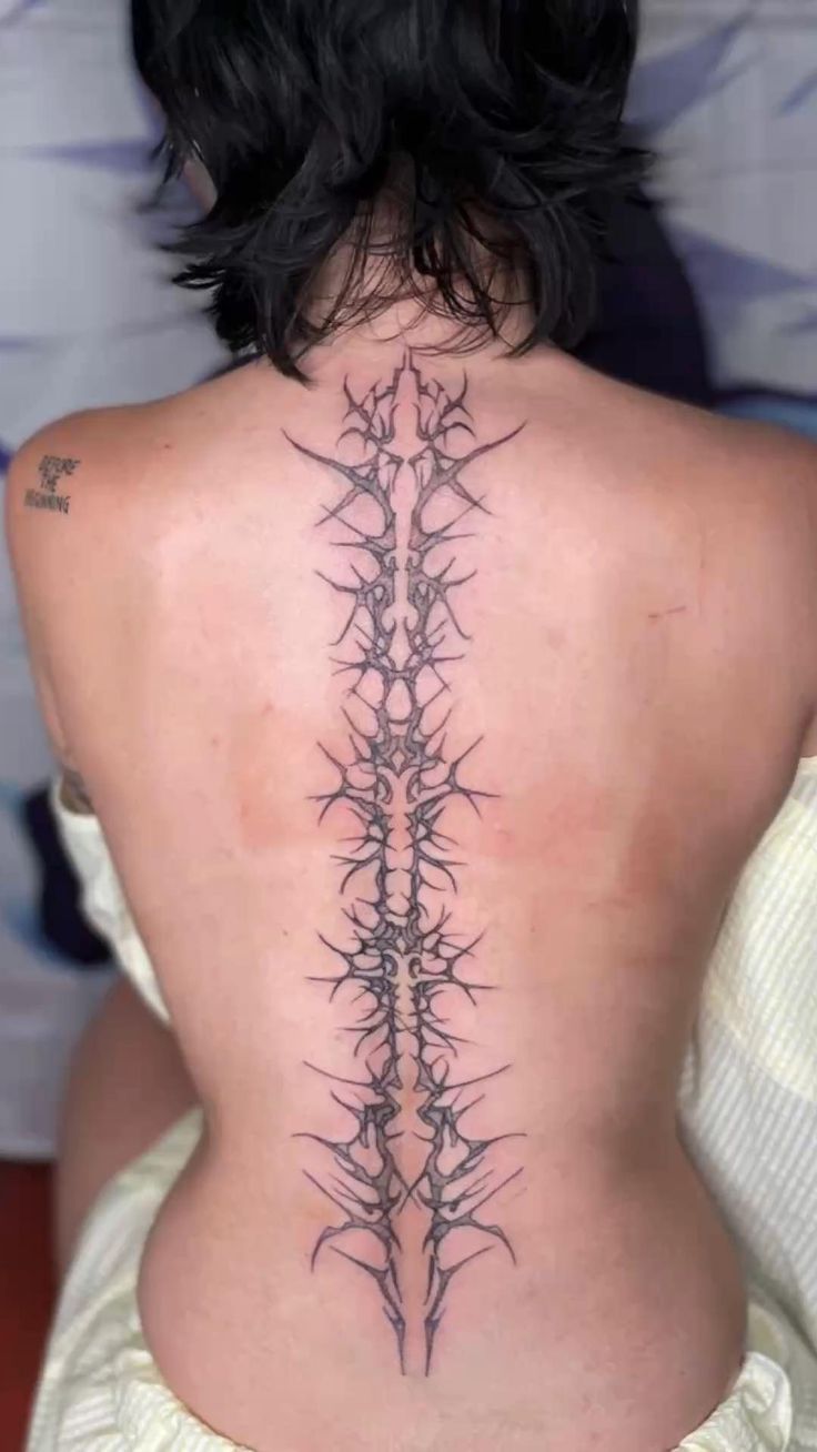 Intricate Blackwork Spine Tattoo