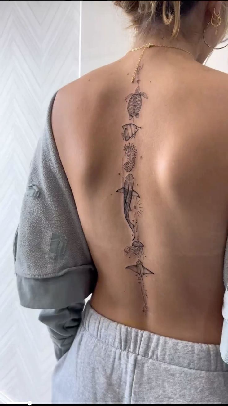 Elegant Spine Tattoo with Marine Life