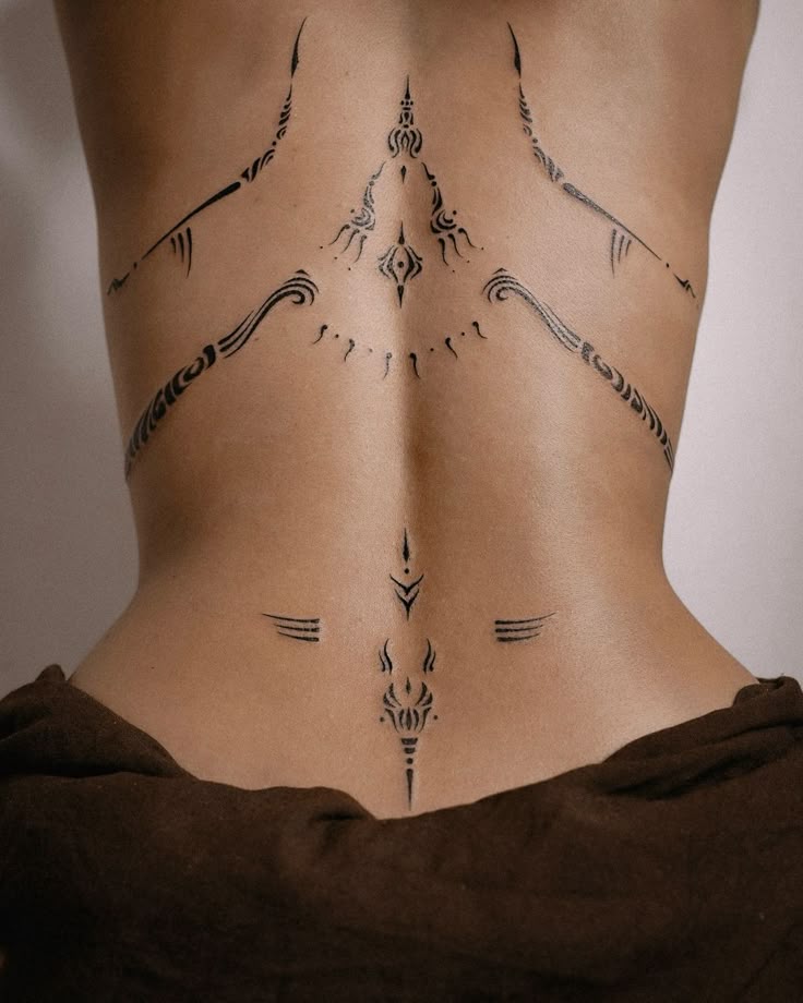 Elegant Tribal Spine Tattoo Design
