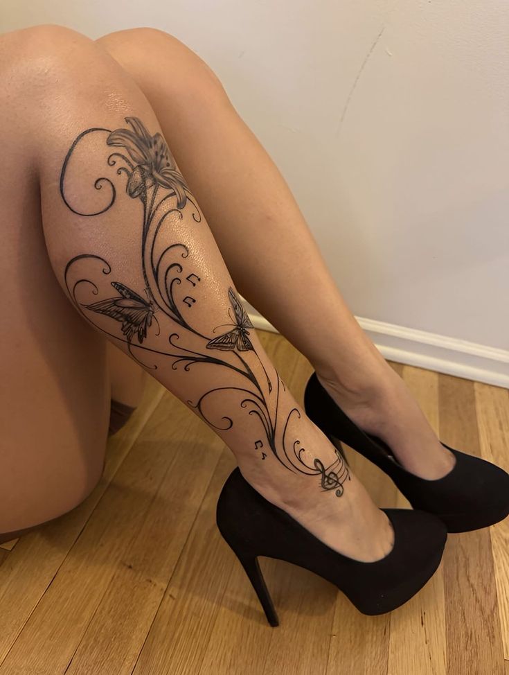 Elegant Floral Leg Tattoo with Butterflies