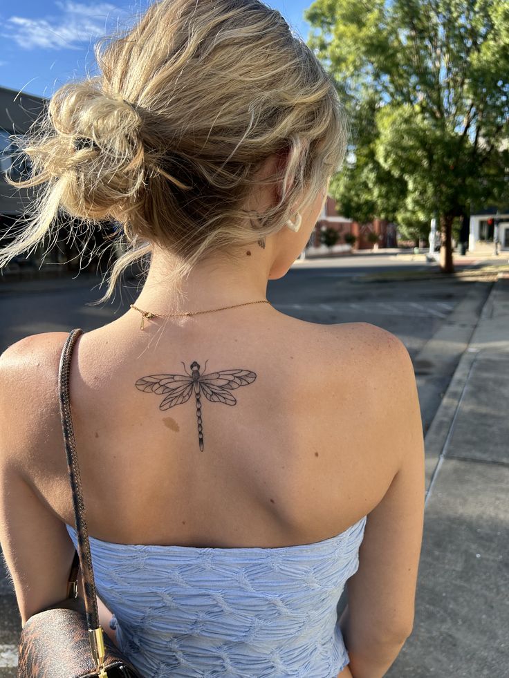 delicate dragonfly tattoo for the back