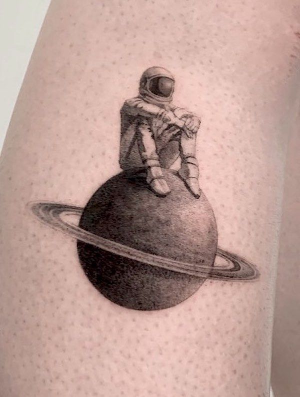Astronaut on Planet Tattoo - A Surreal Space Adventure