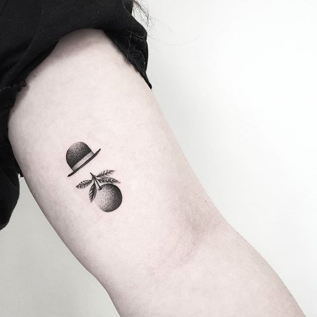 Minimalist Magritte-Inspired Tattoo