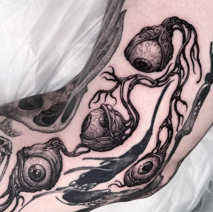 Eerie Eyeballs Blackwork Tattoo