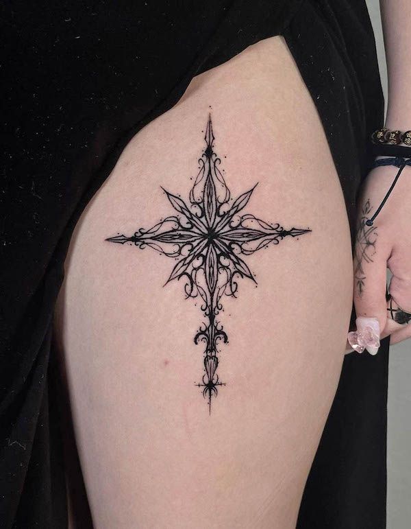 Elegant Blackwork Thigh Tattoo Design
