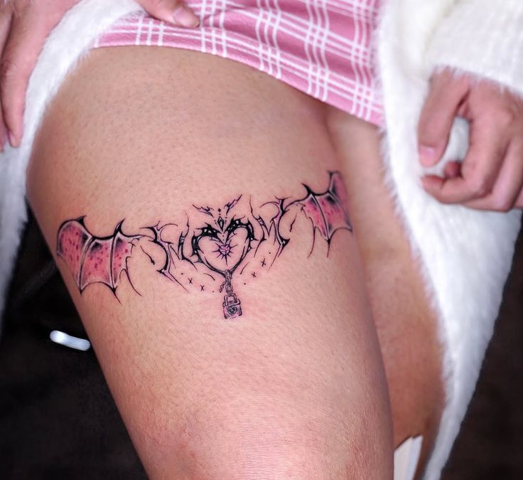 bat heart thigh tattoo
