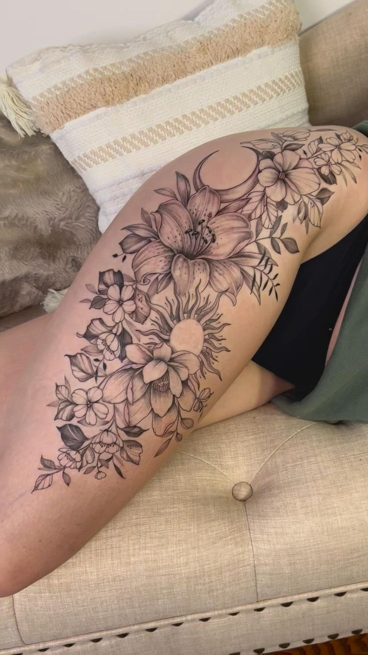 Elegant Floral Thigh Tattoo Design