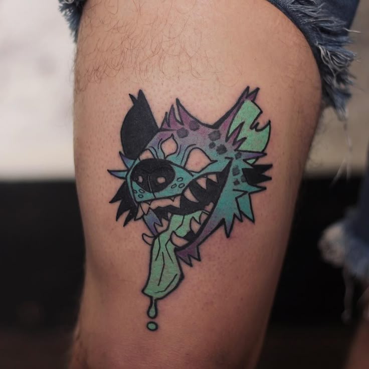 Vibrant Wolf Thigh Tattoo