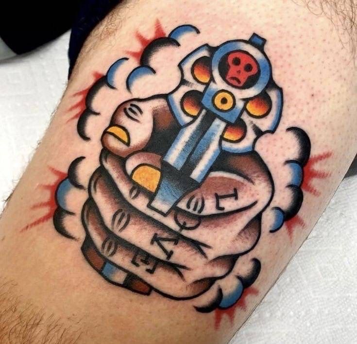 Bold American Traditional Gun Tattoo