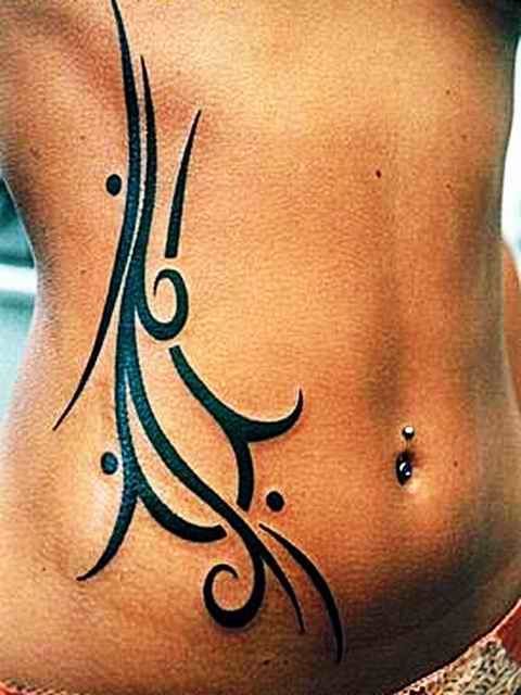 Elegant Tribal Ribcage Tattoo Design