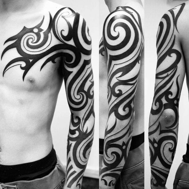 Bold Tribal Arm Sleeve Tattoo