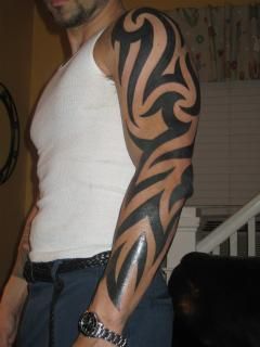 Bold Polynesian Tribal Arm Tattoo