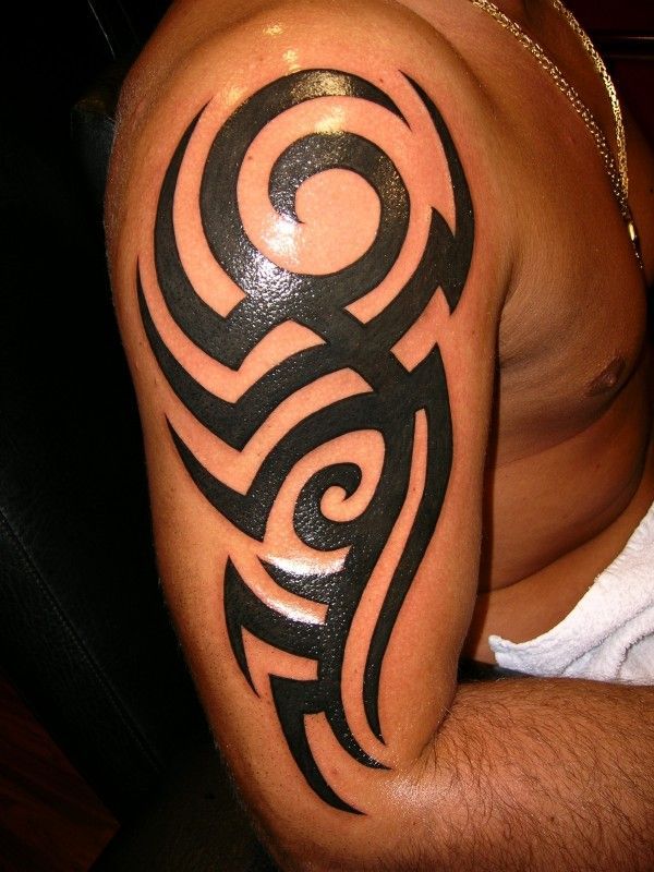 Bold Tribal Arm Tattoo Design