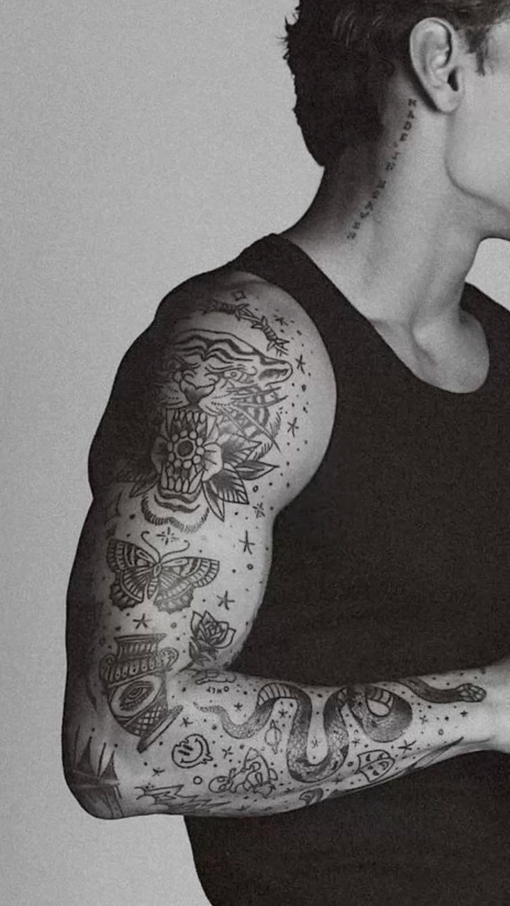 Intricate Traditional Arm Tattoo Design