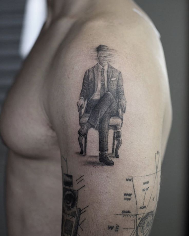 Elegant Seated Man Tattoo Design