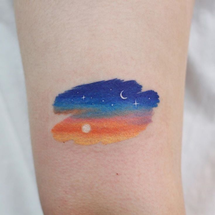 Enchanting Sky Watercolor Tattoo