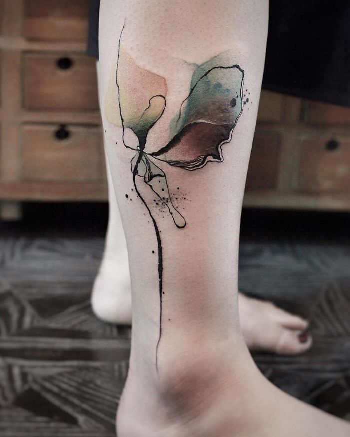 Vibrant Watercolor Leg Tattoo for Artistic Souls
