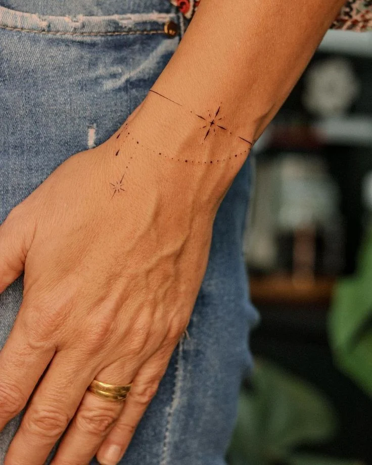 elegant minimalist star tattoo for the wrist