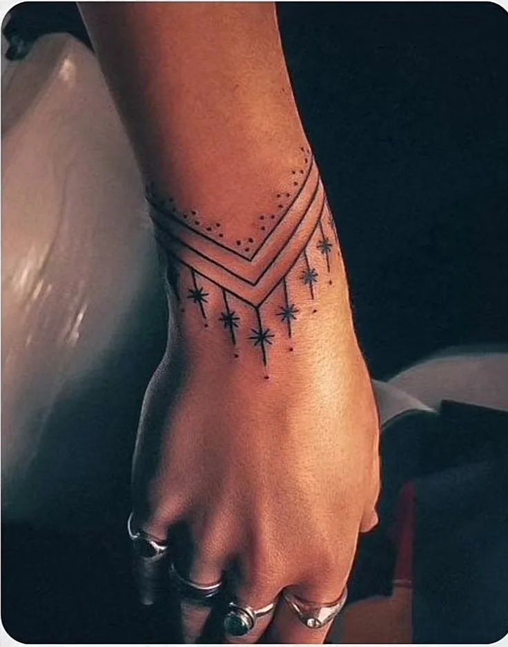 Stunning Geometric Star Wrist Tattoo