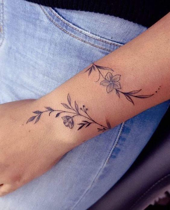 Elegant Floral Wrap Around Wrist Tattoo