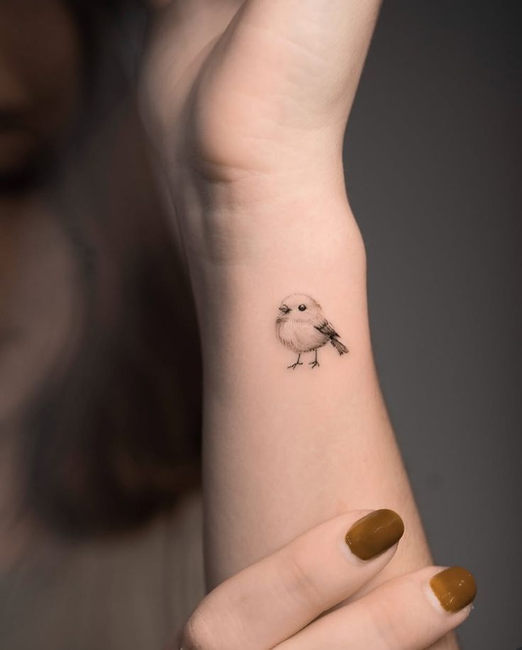 Delicate Sparrow Wrist Tattoo for Minimalist Lovers