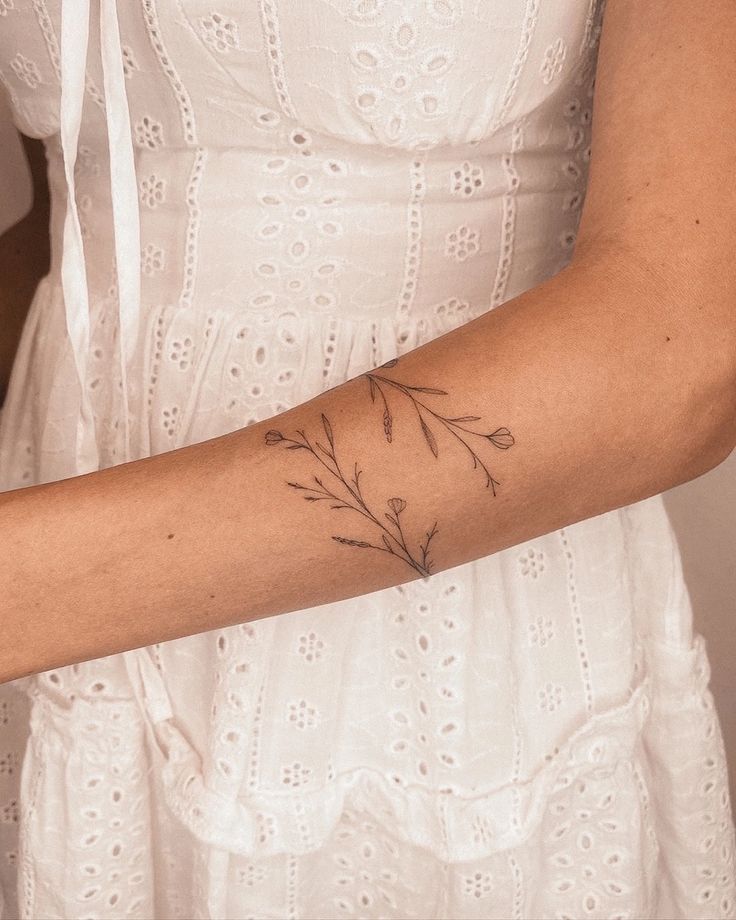 Delicate Minimalist Floral Wrist Tattoo