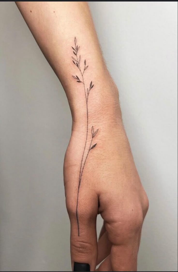 Elegant Minimalist Floral Wrist Tattoo